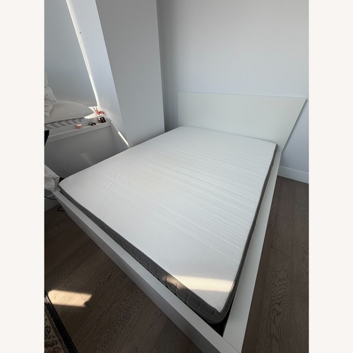 Used IKEA Malm White Queen Bed Lönset Base for sale on AptDeco