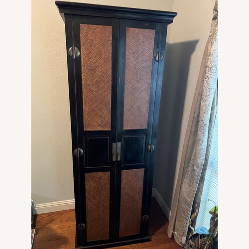 Used Palecek Dark Brown Wood Armoire for sale on AptDeco
