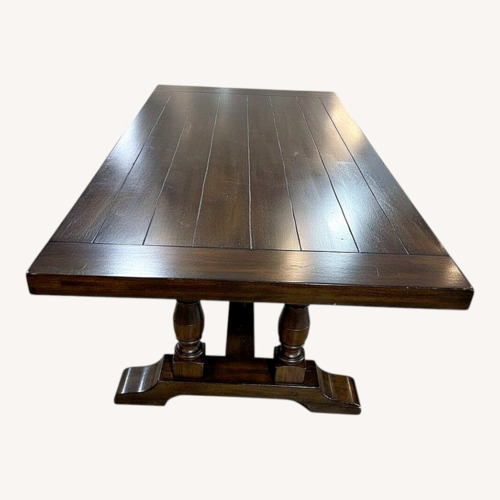 Used Traditional Trestle Solid Wood Dining Table for sale on AptDeco