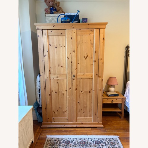 Used Natural Wood Armoire for sale on AptDeco