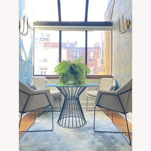 Used West Elm Hourglass Black Glass Dining Table for sale on AptDeco