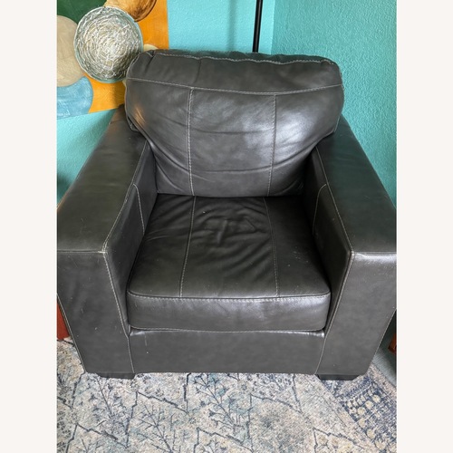 Used Ashley Furniture Morelos Dark Gray Leather Chair Set of 2 for sale on AptDeco