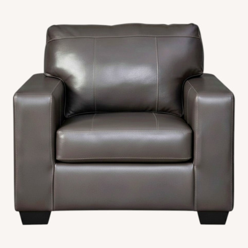 Used Ashley Furniture Morelos Dark Gray Leather Chair Set of 2 for sale on AptDeco