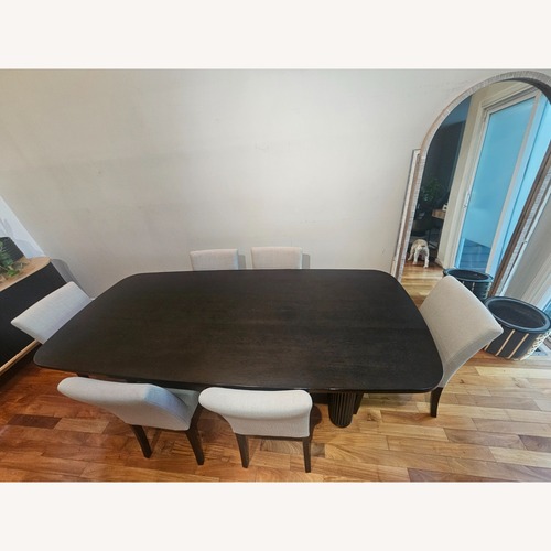 Used Crate & Barrel Black Oak Wood Dining Table for sale on AptDeco