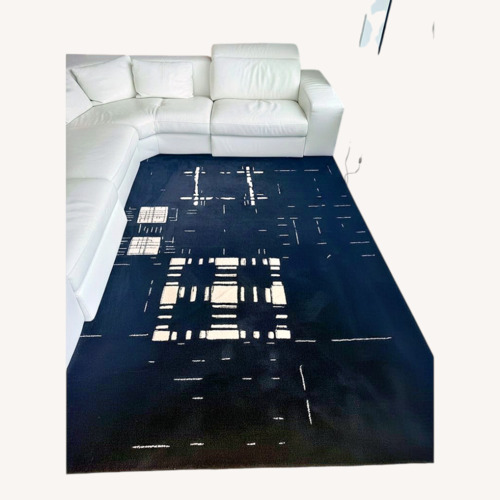 Used Stepevi Rug 9' X 12' Black & Cream Rug for sale on AptDeco