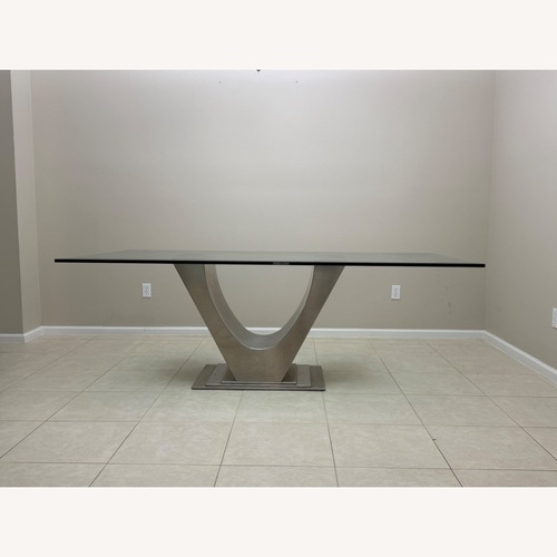 Used Glass Dining Table with Chrome Pedestal  for sale on AptDeco