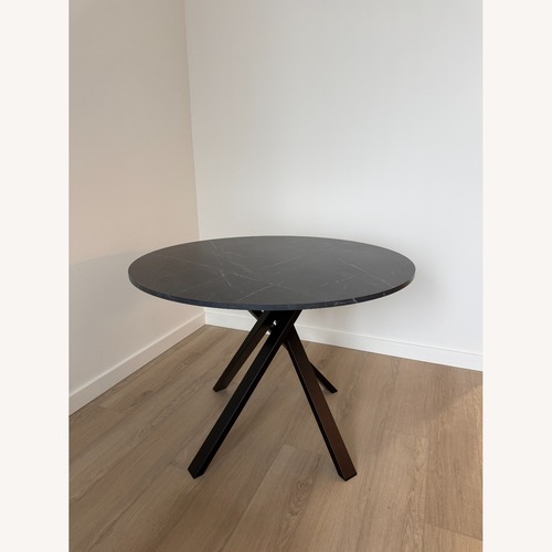 Used IKEA Black Wood Dining Table for sale on AptDeco