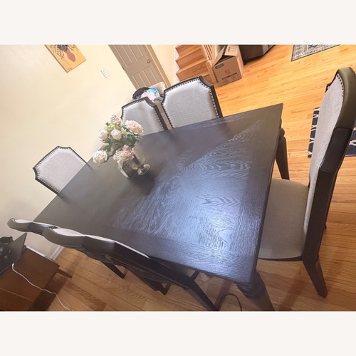 Used Raymour & Flanigan Dark Brown Wood Dining Table for sale on AptDeco