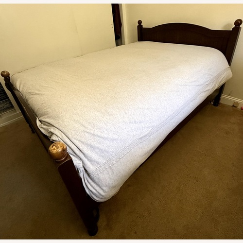 Used Pottery Barn Dark Brown Wood Full Bed for sale on AptDeco