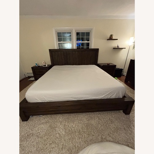 Used Solid Dark Wood King Bed for sale on AptDeco