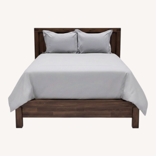 Used Solid Dark Wood King Bed for sale on AptDeco