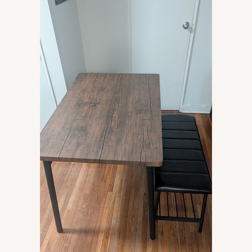 Used Dark Brown Dining Table with Padded Bench for sale on AptDeco