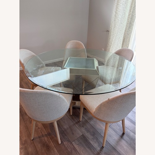 Used Seaford Round Glass Dining Table for sale on AptDeco