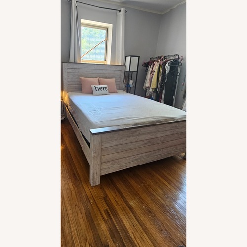 Used Raymour & Flanigan White Wood Queen Bed for sale on AptDeco