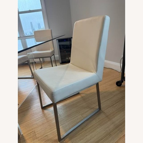 Used White Faux Leather Dining Chairs (6) for sale on AptDeco