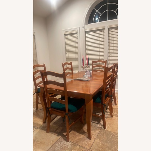 Used Bassett Good Light Brown Wood Dining Table for sale on AptDeco