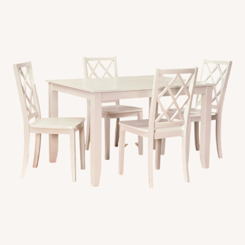 Used White Table with 4 Colorful Chairs for sale on AptDeco