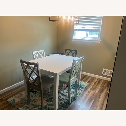 Used White Table with 4 Colorful Chairs  for sale on AptDeco