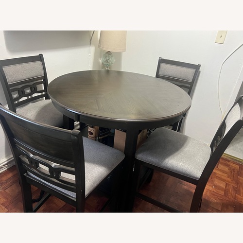 Used Langwest Counter Height Dining Table and 4 Bar Stools for sale on AptDeco