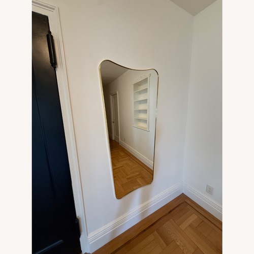 Used Gubi Gold Mirrored Glass Wall Mirror for sale on AptDeco