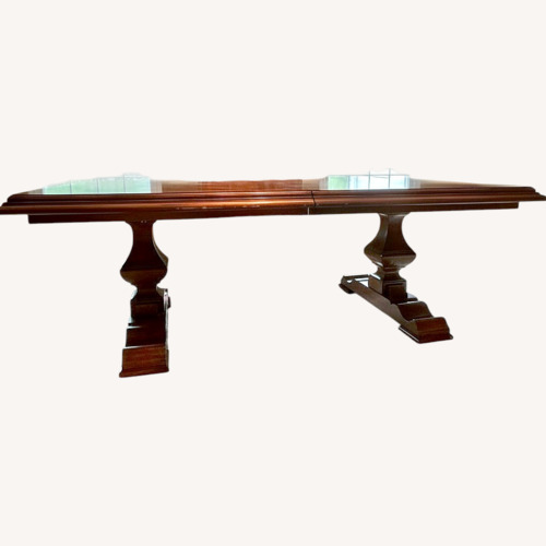 Used Dark Brown Wood Dining Table for sale on AptDeco