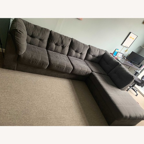 Used Ashley Furniture Marleton Gray Fabric Sectional with Chaise for sale on AptDeco