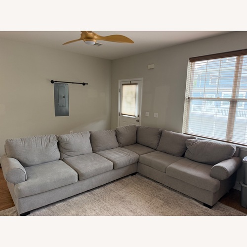 Used Living Spaces Two Piece Sectional Sofa for sale on AptDeco