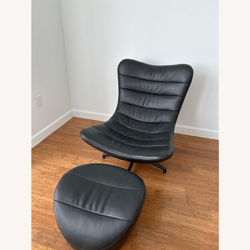 Used Roche Bobois Black Leather Armchair With Ottoman for sale on AptDeco