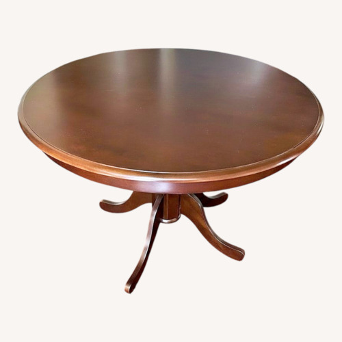 Used Belfort Furniture Wood Round Dining Table for sale on AptDeco