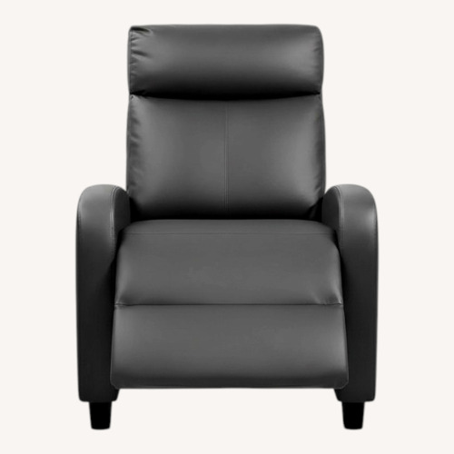 Used Black Leather Recliner With Massage Remote for sale on AptDeco