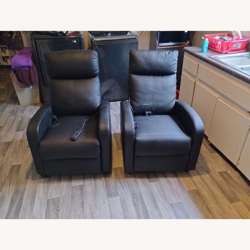 Used Black Leather Recliner With Massage Remote for sale on AptDeco
