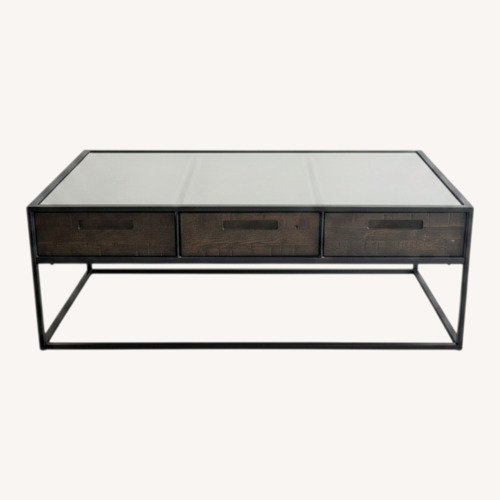 Used Living Spaces Dark Brown Glass Coffee Table for sale on AptDeco