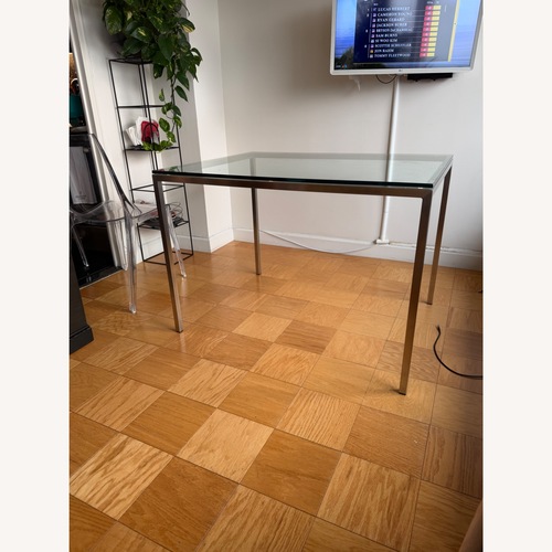 Used Room & Board Transparent Glass Dining Table for sale on AptDeco