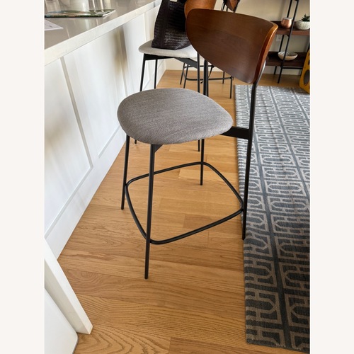 Used West Elm Modern Petal Dark Gray Wood Stool for sale on AptDeco