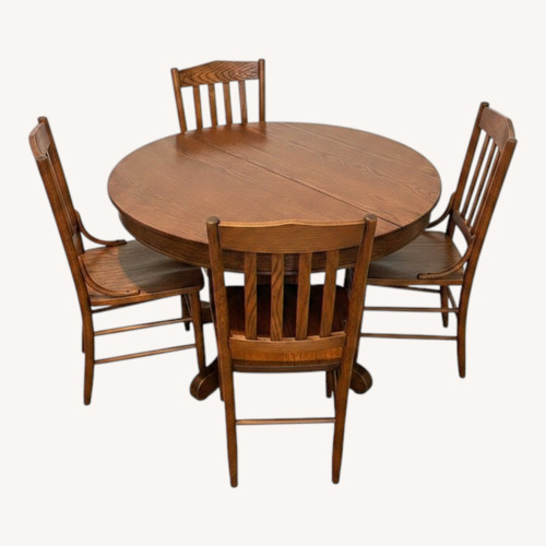 Used Wood Round Table with 4 Chairs for sale on AptDeco