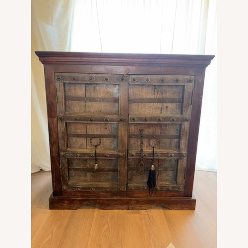 Used Vintage/Antique Finds Dark Brown Wood Armoire for sale on AptDeco