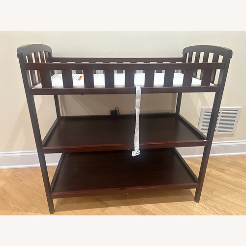 Used Dark Brown Wood Changing Table for sale on AptDeco