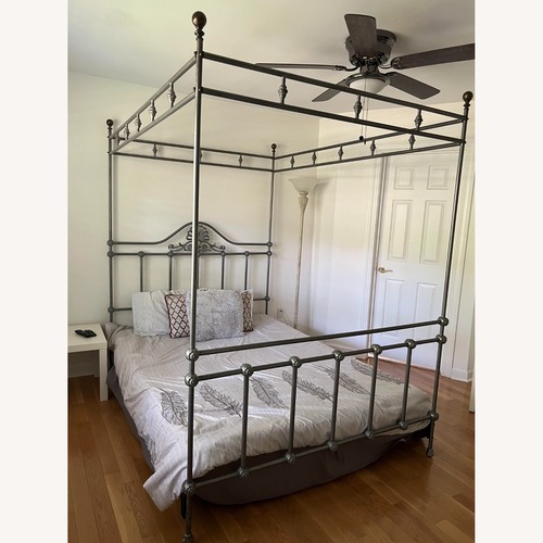 Used Elegant Silver Wrought Iron 4-Poster Queen Bed for sale on AptDeco