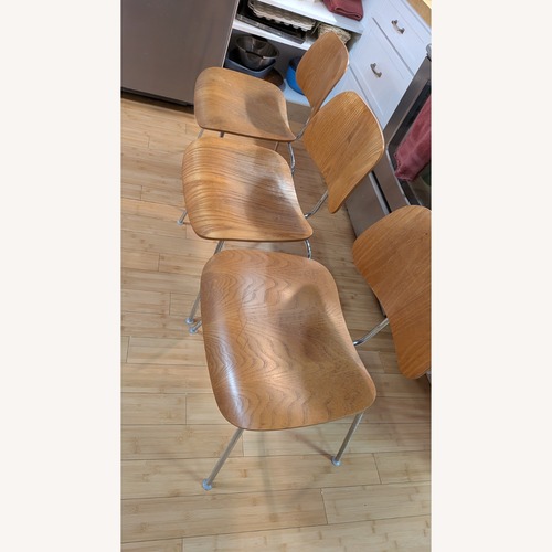 Used Herman Miller Eames Natural Wood Dining Chairs for sale on AptDeco