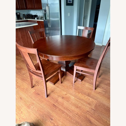 Used Canadel Round Wooden Table for 4 for sale on AptDeco