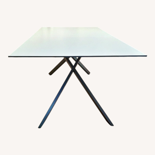 Used Glass Dining Table Top And Silver Stand for sale on AptDeco