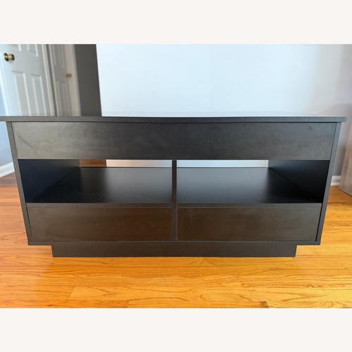 Used Black Wood Coffee Table for sale on AptDeco