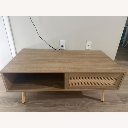 Used Natural Oak Coffee Table with Sliding Door for sale on AptDeco
