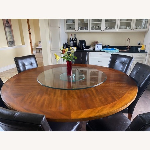 Used Round Dining Set With Leather Chairs for sale on AptDeco
