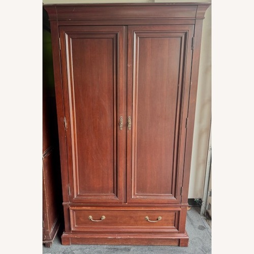 Used Dark Brown Wood Armoire by Vermont Tubbs  for sale on AptDeco