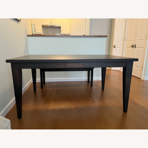 Used Bassett Black Wood Dining Table for sale on AptDeco