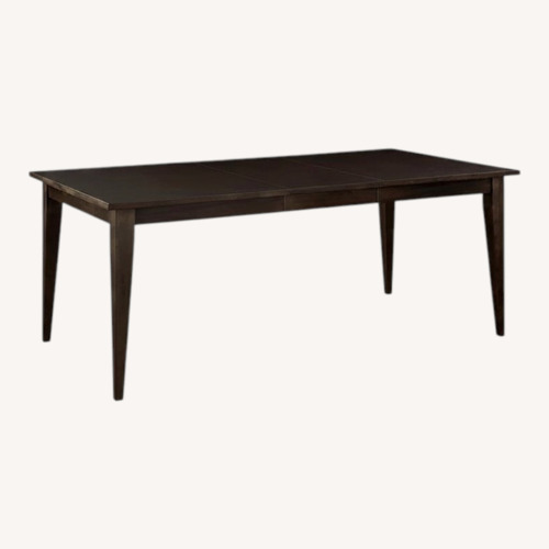 Used Bassett Black Wood Dining Table for sale on AptDeco