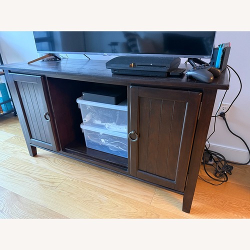 Used Dark Brown Wood Entertainment Center for sale on AptDeco