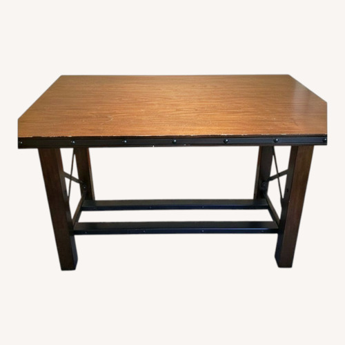 Used Dark Brown Wood Dining Table for sale on AptDeco