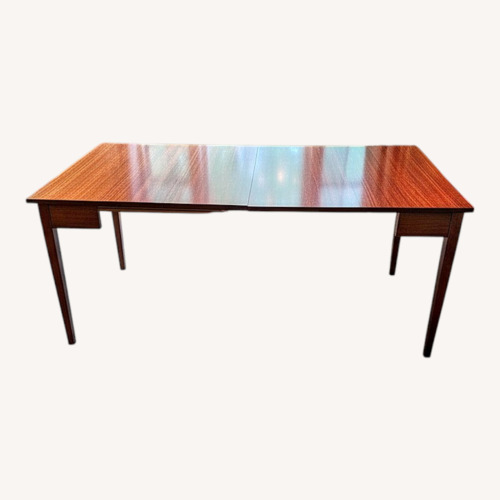 Used Dark Brown Wood Dining Table for sale on AptDeco